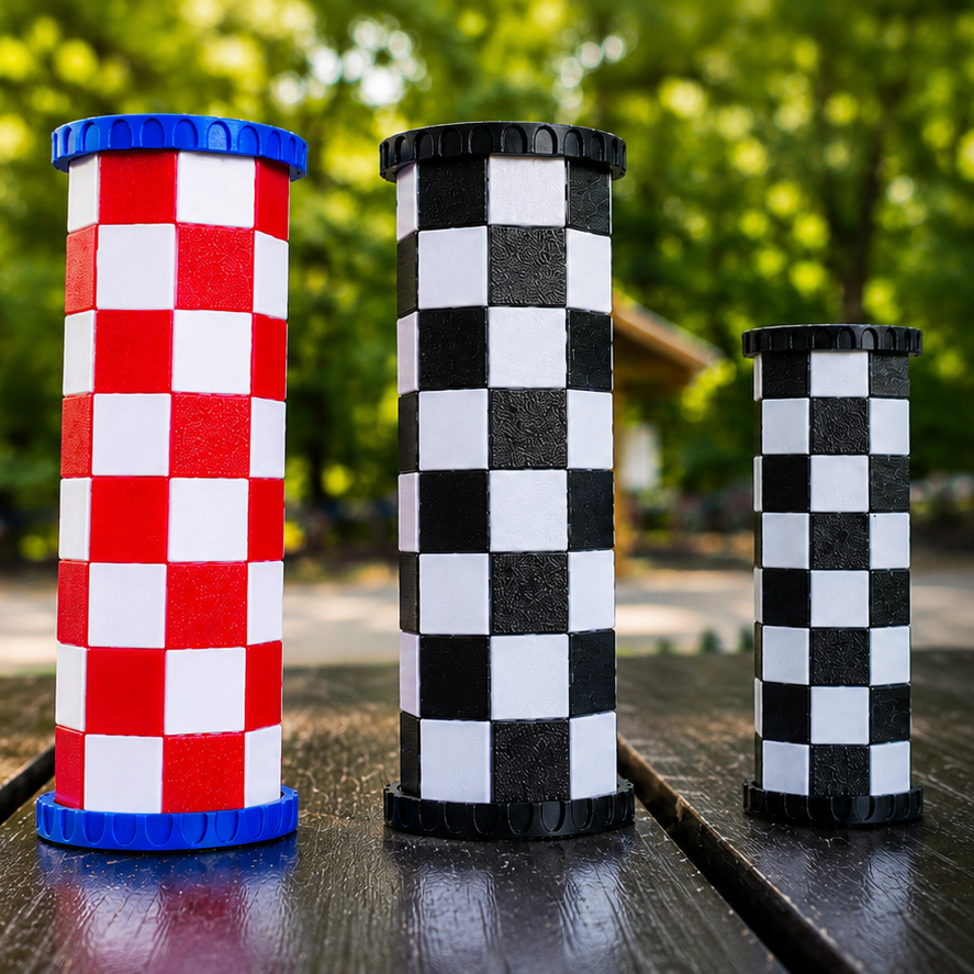 Travel chess set with checkered pieces on a wooden surface outdoors.