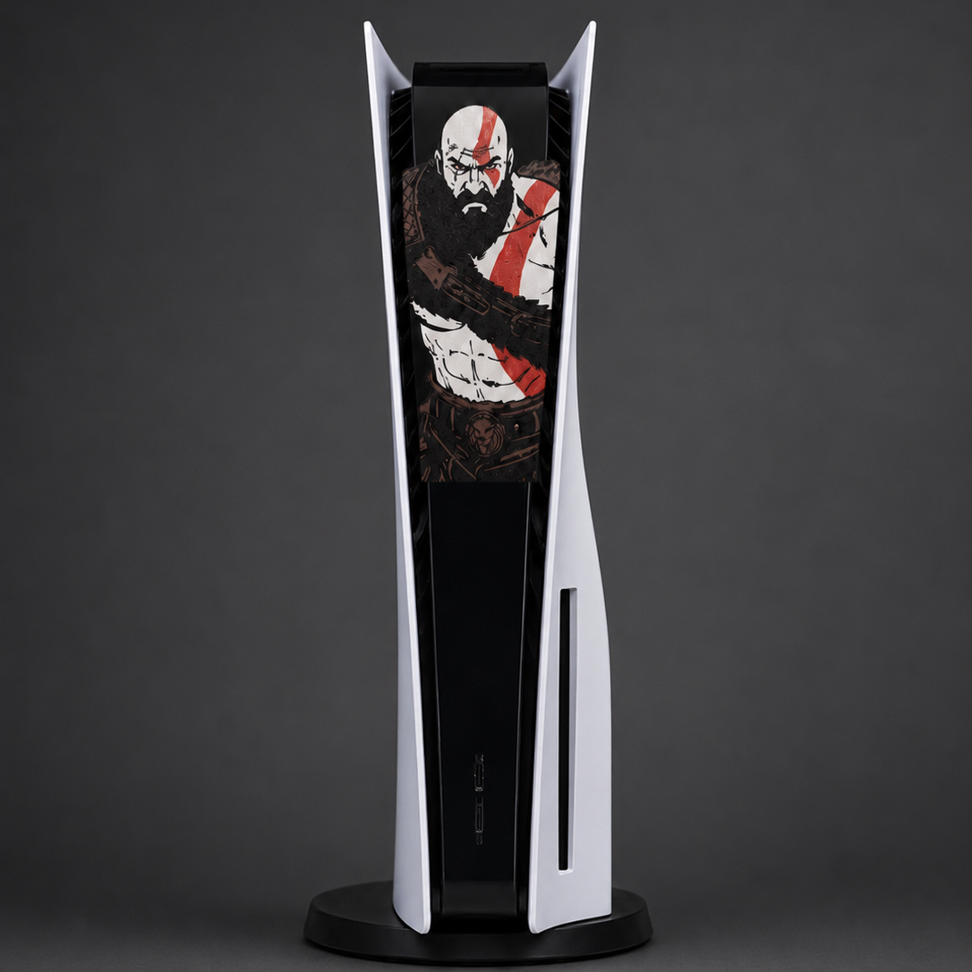 A PlayStation 5 console in a custom Kratos skin, standing vertically on a black circular display stand against a dark gray studio background.